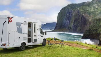 Pilote P690D parked up on the grass in front of a sea view