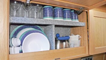 Crockery and cups in cupboard
