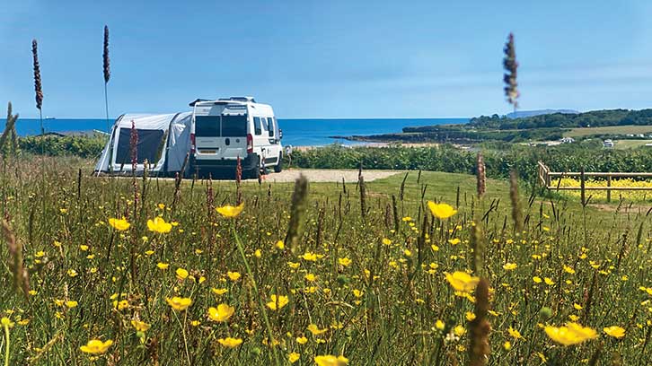 Van pitched up with sea view at Tyddyn Isaf