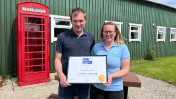 Kate and Alastair holding the certificate