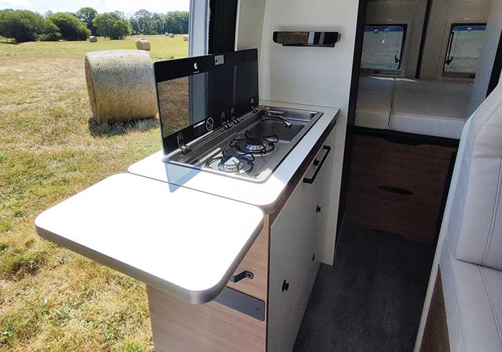 Galley kitchen of the Pilote motorhome with the fold-out worktop extended.