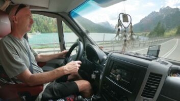 A man driving a motorhome.