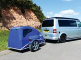 A campervan with a trailer attached