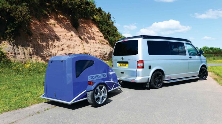 A campervan with a trailer attached