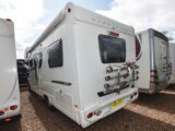 A fixed bike rack on the back of a motorhome