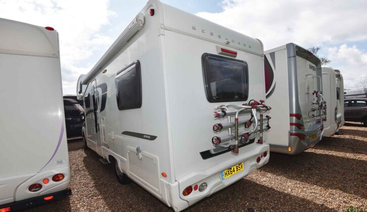 A fixed bike rack on the back of a motorhome