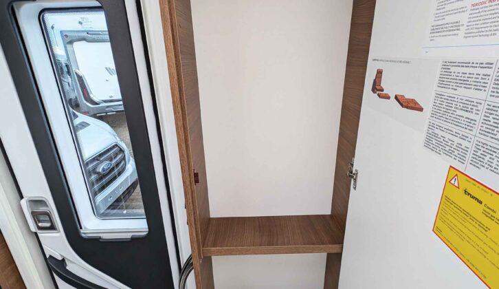 The wardrobe has a hanging rail